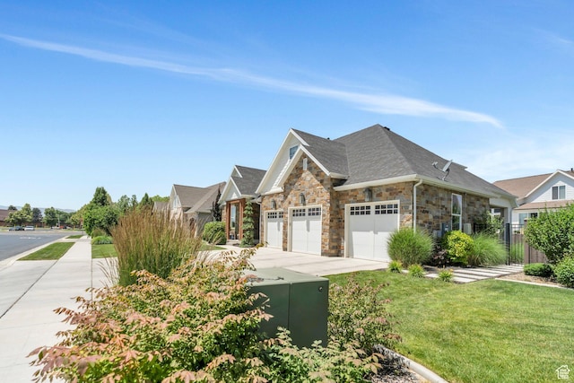 953 E 1000 N, American Fork, UT 84003 - view of front facade featuring a garage, stone siding, and concrete driveway