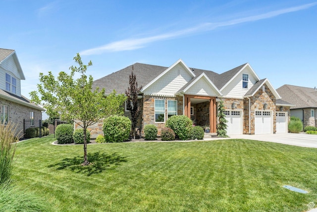 953 E 1000 N, American Fork, UT 84003 - view of front of home with concrete driveway, an attached garage, stone siding, and roof with shingles
