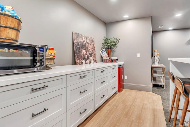 953 E 1000 N, American Fork, UT 84003 - kitchen featuring stainless steel microwave, light countertops, recessed lighting, and white cabinets