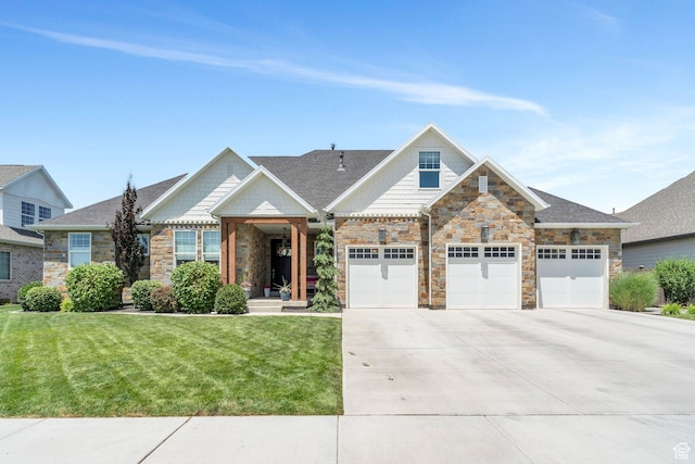 953 E 1000 N, American Fork, UT 84003 - view of front of house with driveway, stone siding, a front yard, and an attached garage