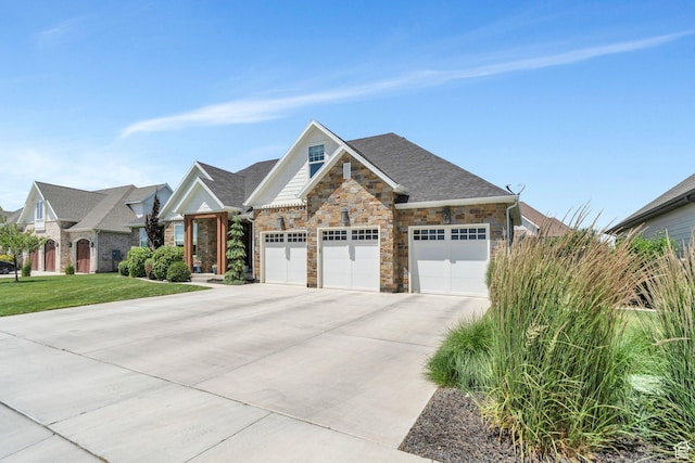 953 E 1000 N, American Fork, UT 84003 - view of front facade with concrete driveway, stone siding, a garage, and a front lawn