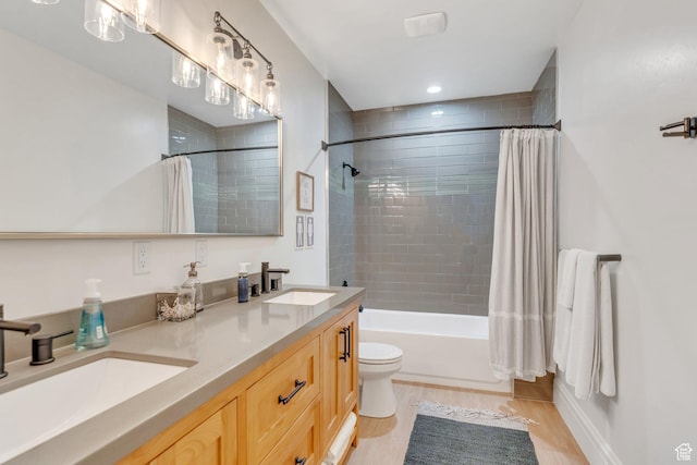 953 E 1000 N, American Fork, UT 84003 - bathroom featuring double vanity, shower / tub combo with curtain, and wood finished floors