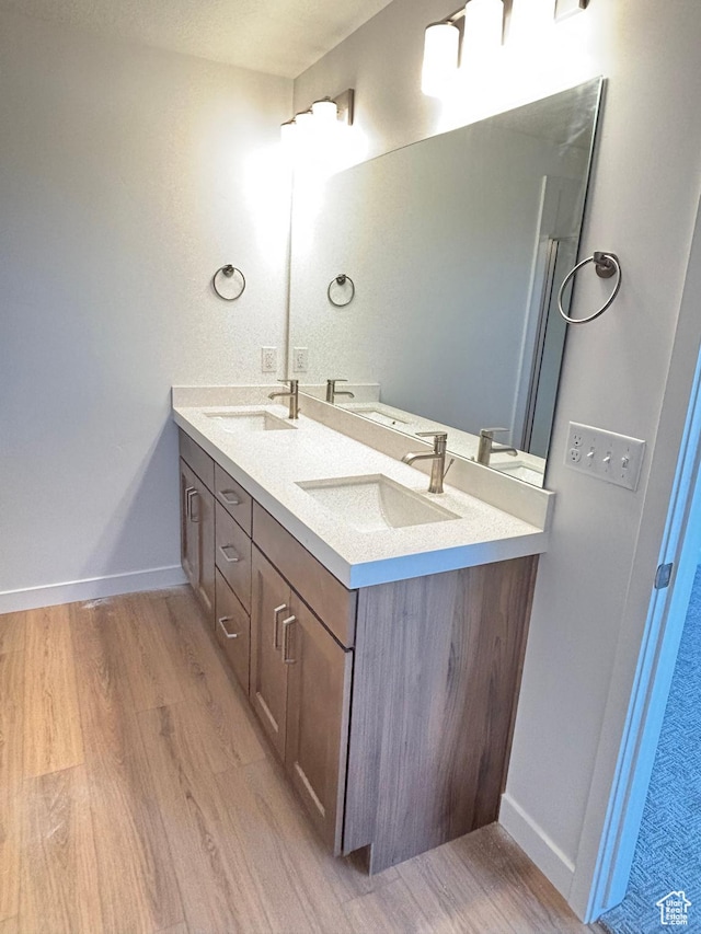 4683 S Roger View Ln W Unit 7, West Valley City, UT 84120 - full bathroom with wood finished floors and double vanity