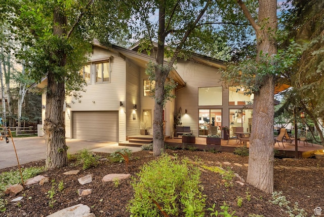 2626 Meadow Creek Dr, Park City, UT 84060 - view of front of home featuring driveway, an attached garage, and a deck