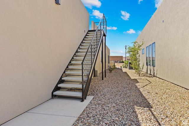 4982 W 3175 S, Hurricane, UT 84737 - view of property exterior with stucco siding and stairs