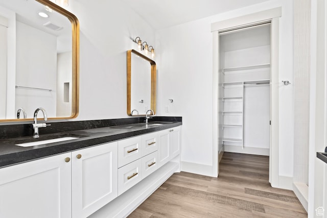 4982 W 3175 S, Hurricane, UT 84737 - bathroom featuring double vanity and wood finished floors
