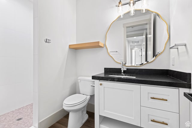 4982 W 3175 S, Hurricane, UT 84737 - full bath featuring vanity, a tile shower, and wood finished floors