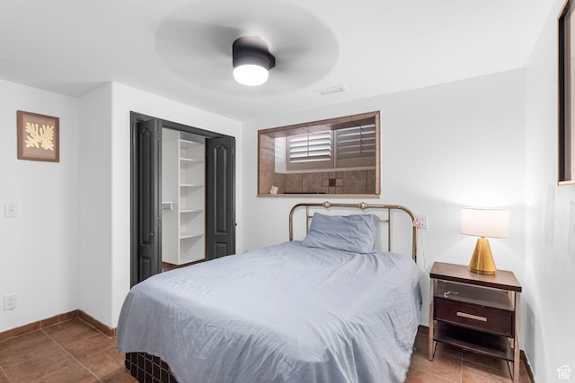 143 E 200 S, St George, UT 84770 - tiled bedroom with baseboards and ceiling fan