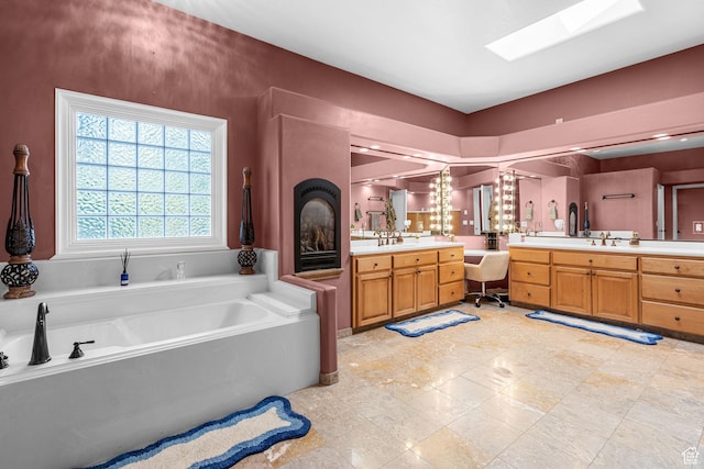 143 E 200 S, St George, UT 84770 - full bath with vanity, a bath, and a skylight