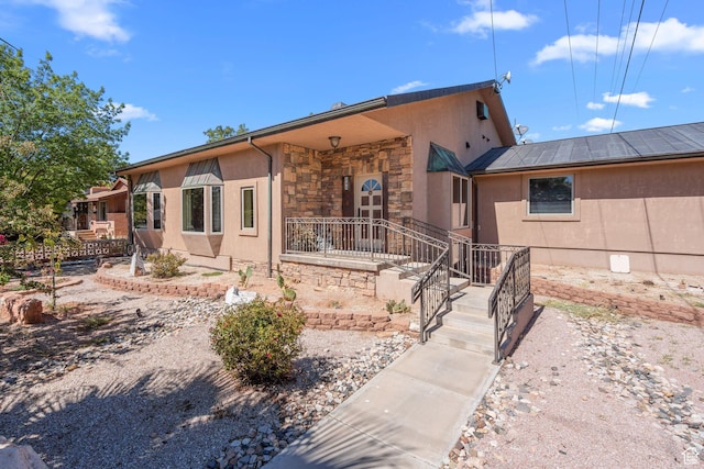 143 E 200 S, St George, UT 84770 - view of front of home with stucco siding and stone siding