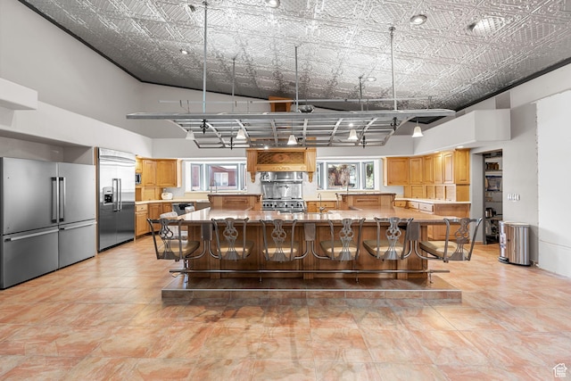 143 E 200 S, St George, UT 84770 - kitchen with appliances with stainless steel finishes, plenty of natural light, a kitchen breakfast bar, and a spacious island
