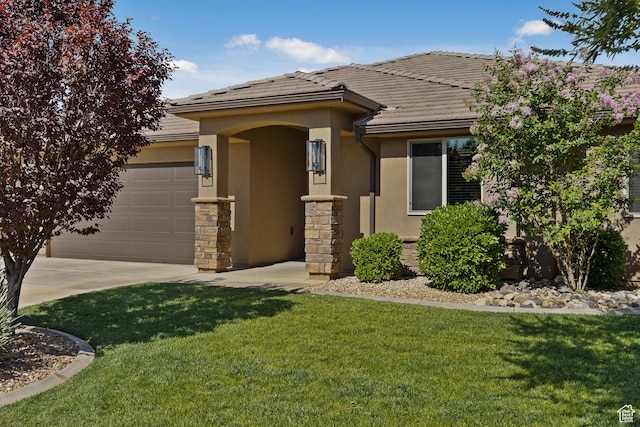 3342 S 240 W, Washington, UT 84780 - view of front of home with stucco siding, a garage, a tiled roof, and a front lawn