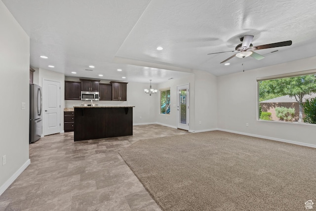3342 S 240 W, Washington, UT 84780 - unfurnished living room featuring a chandelier, a ceiling fan, and recessed lighting