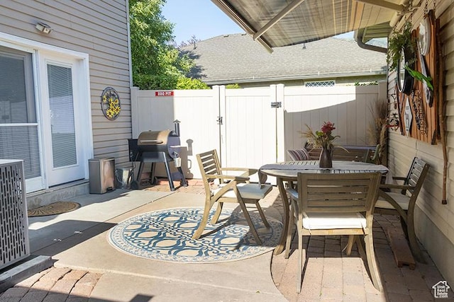 435 W Cobblestone Dr, Providence, UT 84332 - fenced backyard featuring outdoor dining space, a patio area, and grilling area