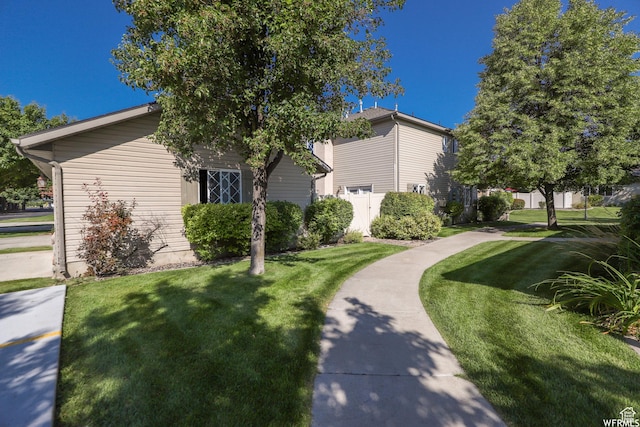 435 W Cobblestone Dr, Providence, UT 84332 - view of side of property featuring a lawn