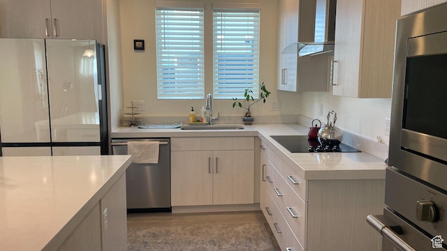 4678 W Vermillion Dr S, South Jordan, UT 84009 - kitchen with wall chimney range hood, freestanding refrigerator, black electric cooktop, stainless steel dishwasher, and plenty of natural light