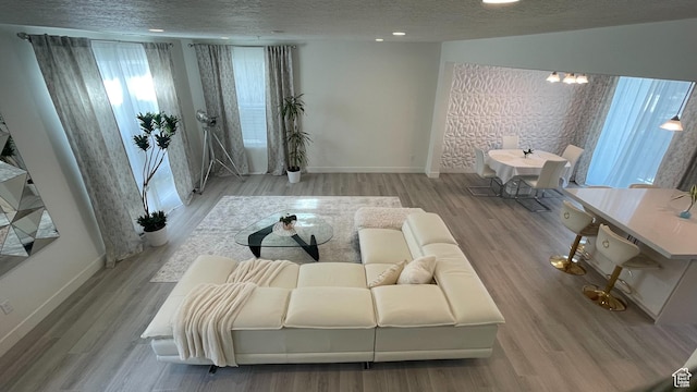 4678 W Vermillion Dr S, South Jordan, UT 84009 - living area featuring a textured ceiling and wood finished floors