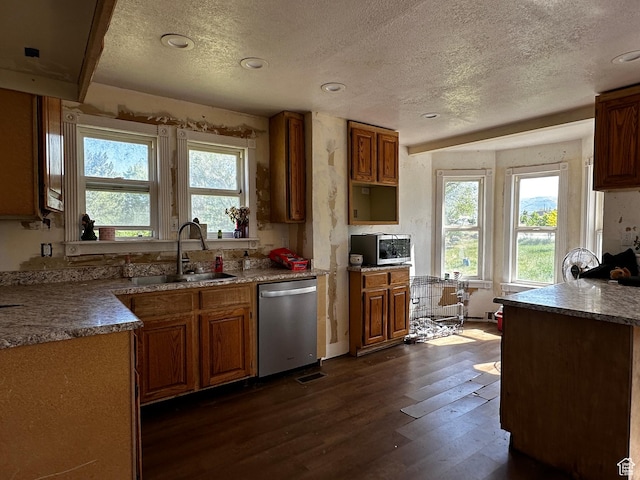 375 E 200 N, Spring City, UT 84662 - kitchen with stainless steel appliances, a textured ceiling, dark wood-style flooring, healthy amount of natural light, and brown cabinetry