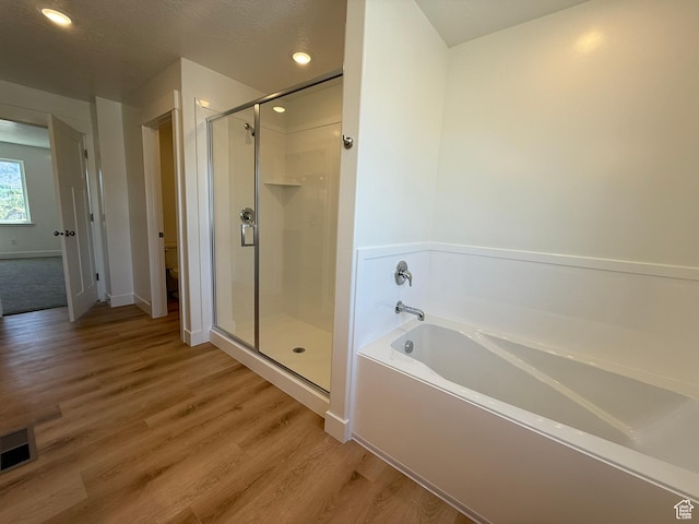 3298 S 1000 W, Nibley, UT 84321 - full bath with a bath, a stall shower, wood finished floors, and recessed lighting