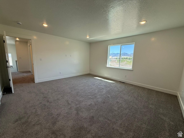 3298 S 1000 W, Nibley, UT 84321 - carpeted spare room with a textured ceiling and recessed lighting