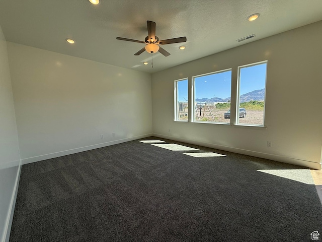 3298 S 1000 W, Nibley, UT 84321 - empty room with dark carpet, a ceiling fan, and recessed lighting