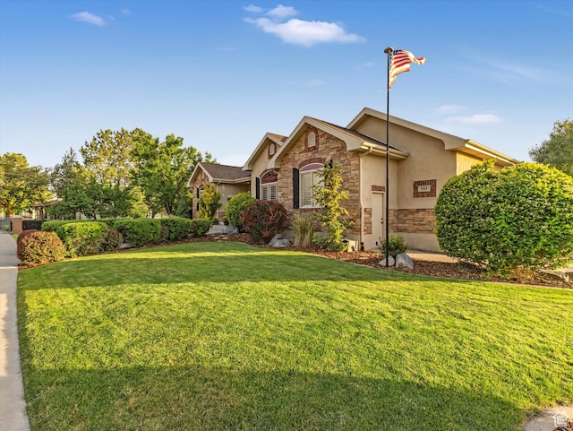 456 S 1100 E, Pleasant Grove, UT 84062 - view of front of house with stone siding, a front yard, and stucco siding