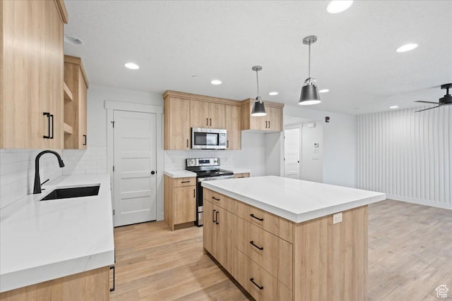 2230 S 635 W Unit C, Perry, UT 84302 - kitchen with appliances with stainless steel finishes, light brown cabinets, light wood finished floors, light countertops, and ceiling fan