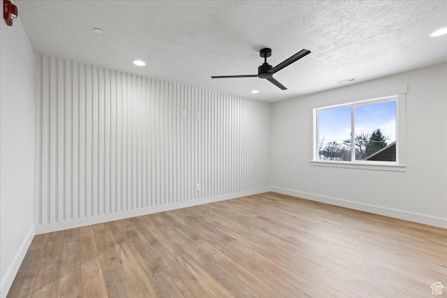 2230 S 635 W Unit C, Perry, UT 84302 - empty room featuring a ceiling fan, light wood-type flooring, a textured ceiling, and recessed lighting