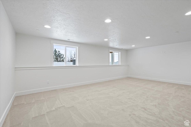 2230 S 635 W Unit C, Perry, UT 84302 - empty room with light colored carpet, recessed lighting, and a textured ceiling