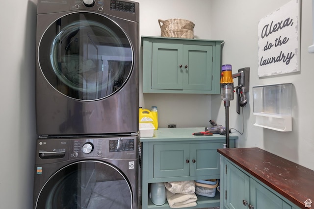 6447 W Arranmore Dr, South Jordan, UT 84009 - laundry area with cabinet space and stacked washer / dryer