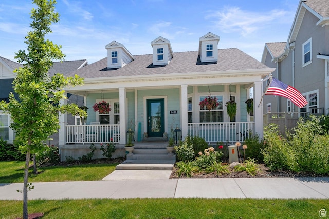 6447 W Arranmore Dr, South Jordan, UT 84009 - view of front of home with covered porch and a shingled roof