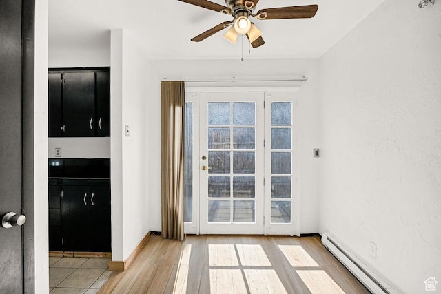 357 W 1100 N Unit 7, Logan, UT 84341 - doorway to outside featuring a baseboard radiator, a ceiling fan, and wood finished floors