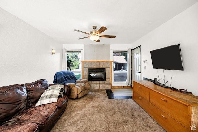 357 W 1100 N Unit 7, Logan, UT 84341 - carpeted living area with a tiled fireplace and a ceiling fan