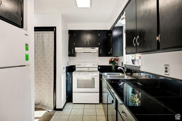 357 W 1100 N Unit 7, Logan, UT 84341 - kitchen featuring white appliances, under cabinet range hood, dark cabinetry, and light tile patterned floors