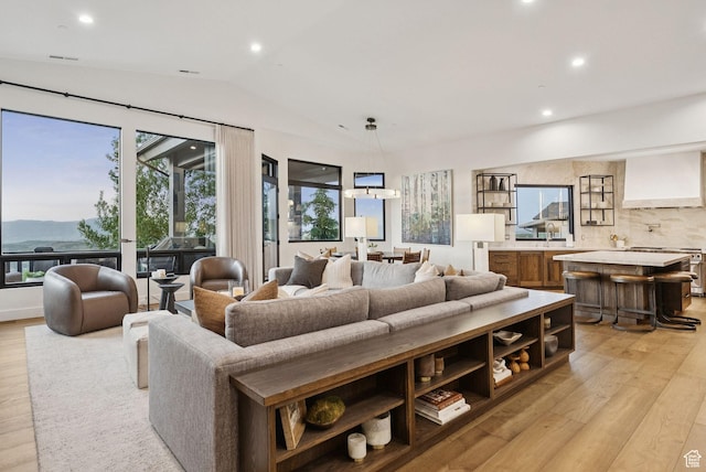 1427 Eagle Way, Park City, UT 84060 - living room with light wood-style floors, plenty of natural light, lofted ceiling, recessed lighting, and a mountain view