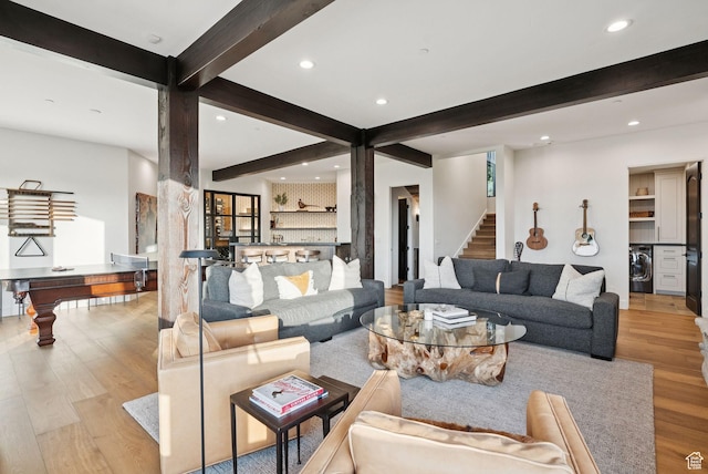 1427 Eagle Way, Park City, UT 84060 - living area featuring washer / clothes dryer, beamed ceiling, wood finished floors, recessed lighting, and stairway