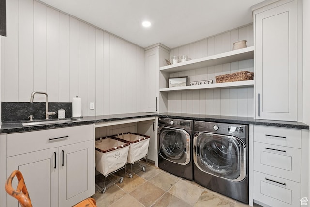 1427 Eagle Way, Park City, UT 84060 - laundry room featuring independent washer and dryer, cabinet space, light stone finish flooring, and wooden walls