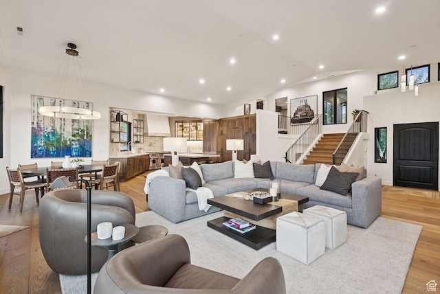 1427 Eagle Way, Park City, UT 84060 - living area featuring recessed lighting, light wood-style floors, lofted ceiling, and stairs