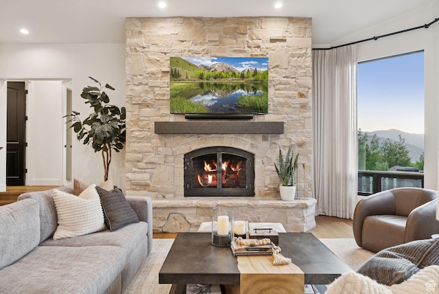 1427 Eagle Way, Park City, UT 84060 - living area featuring wood finished floors, a stone fireplace, healthy amount of natural light, and recessed lighting