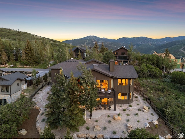 1427 Eagle Way, Park City, UT 84060 - rear view of house with a patio, a balcony, a mountain view, a chimney, and board and batten siding