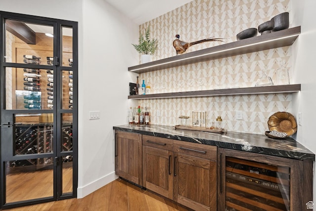 1427 Eagle Way, Park City, UT 84060 - indoor wet bar with wine cooler, light wood-type flooring, and backsplash