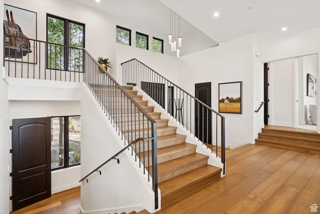 1427 Eagle Way, Park City, UT 84060 - stairs with hardwood / wood-style floors, a high ceiling, plenty of natural light, and recessed lighting