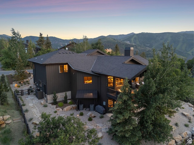 1427 Eagle Way, Park City, UT 84060 - back of property at dusk with a mountain view and a shingled roof