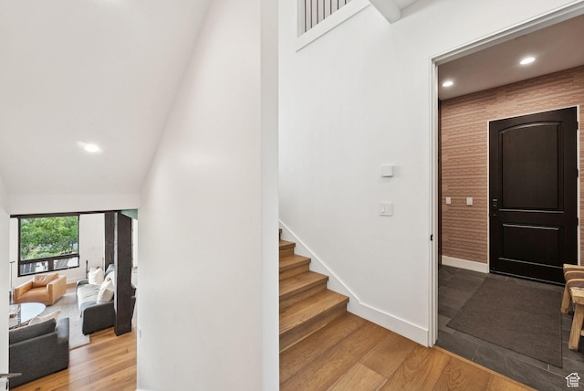 1427 Eagle Way, Park City, UT 84060 - stairway featuring wood finished floors, a towering ceiling, and recessed lighting