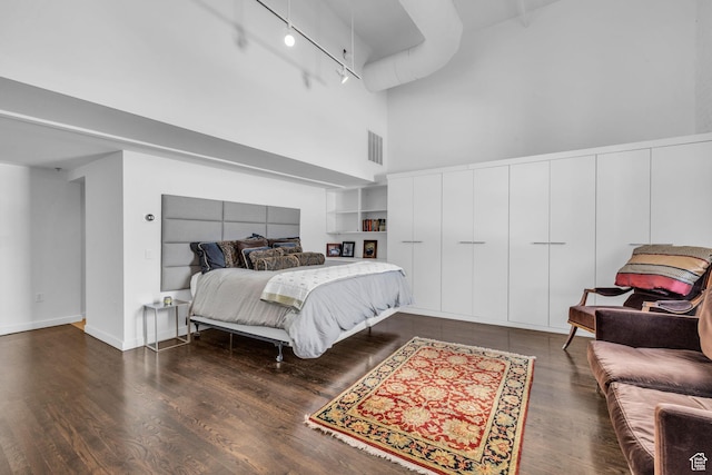 159 W Broadway Unit 301, Salt Lake City, UT 84101 - bedroom with a high ceiling, track lighting, and wood finished floors