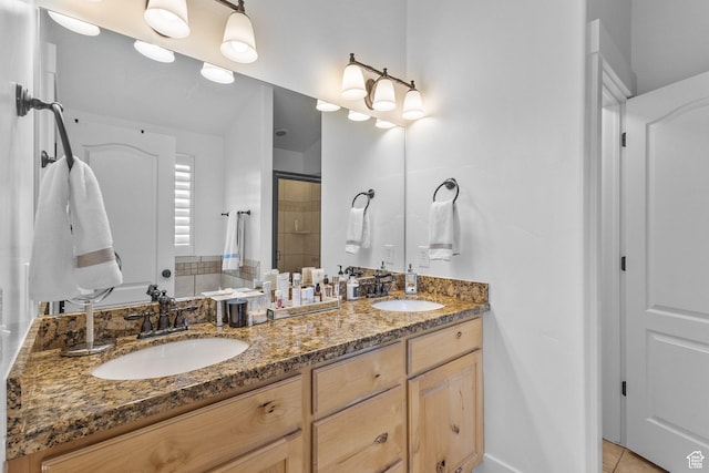 4269 W Lake Brg S, South Jordan, UT 84009 - full bathroom featuring double vanity, a stall shower, and tile patterned flooring