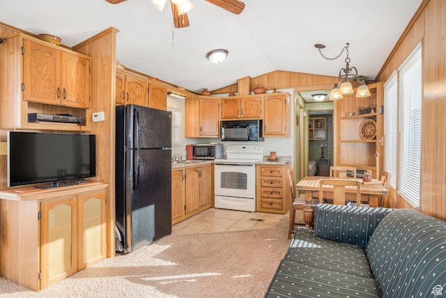 1225 N Dixie Downs Unit 119, St George, UT 84770 - kitchen featuring black appliances, vaulted ceiling, light tile patterned floors, a ceiling fan, and light countertops