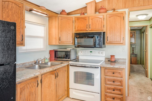 1225 N Dixie Downs Unit 119, St George, UT 84770 - kitchen featuring black appliances, light countertops, and light carpet