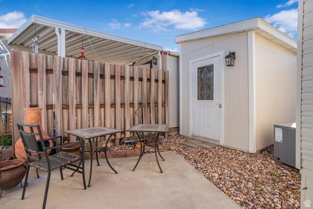 1225 N Dixie Downs Unit 119, St George, UT 84770 - view of patio / terrace with a storage unit