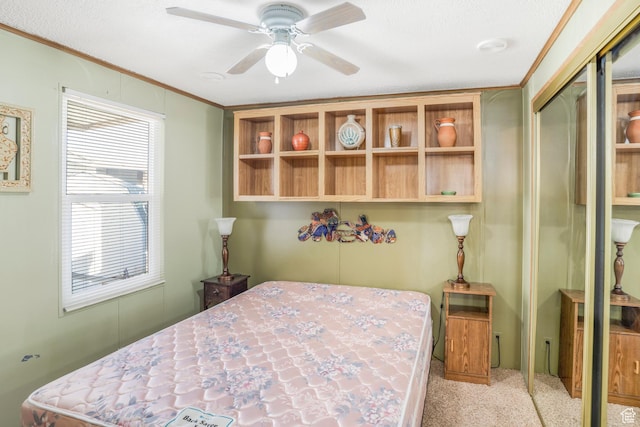 1225 N Dixie Downs Unit 119, St George, UT 84770 - carpeted bedroom featuring a closet, ornamental molding, and a ceiling fan